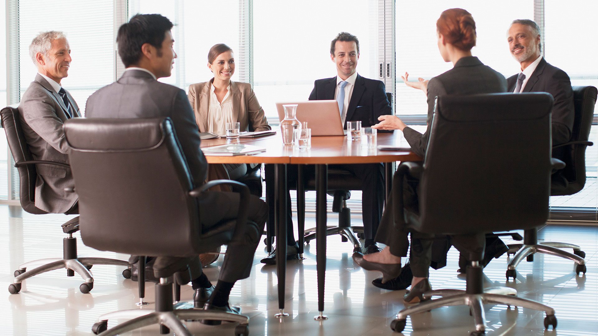 A company meeting at a board table